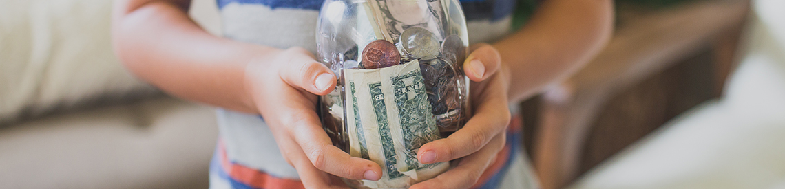 Child with money jar