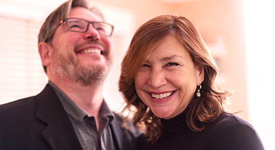 Happy mature couple in their home