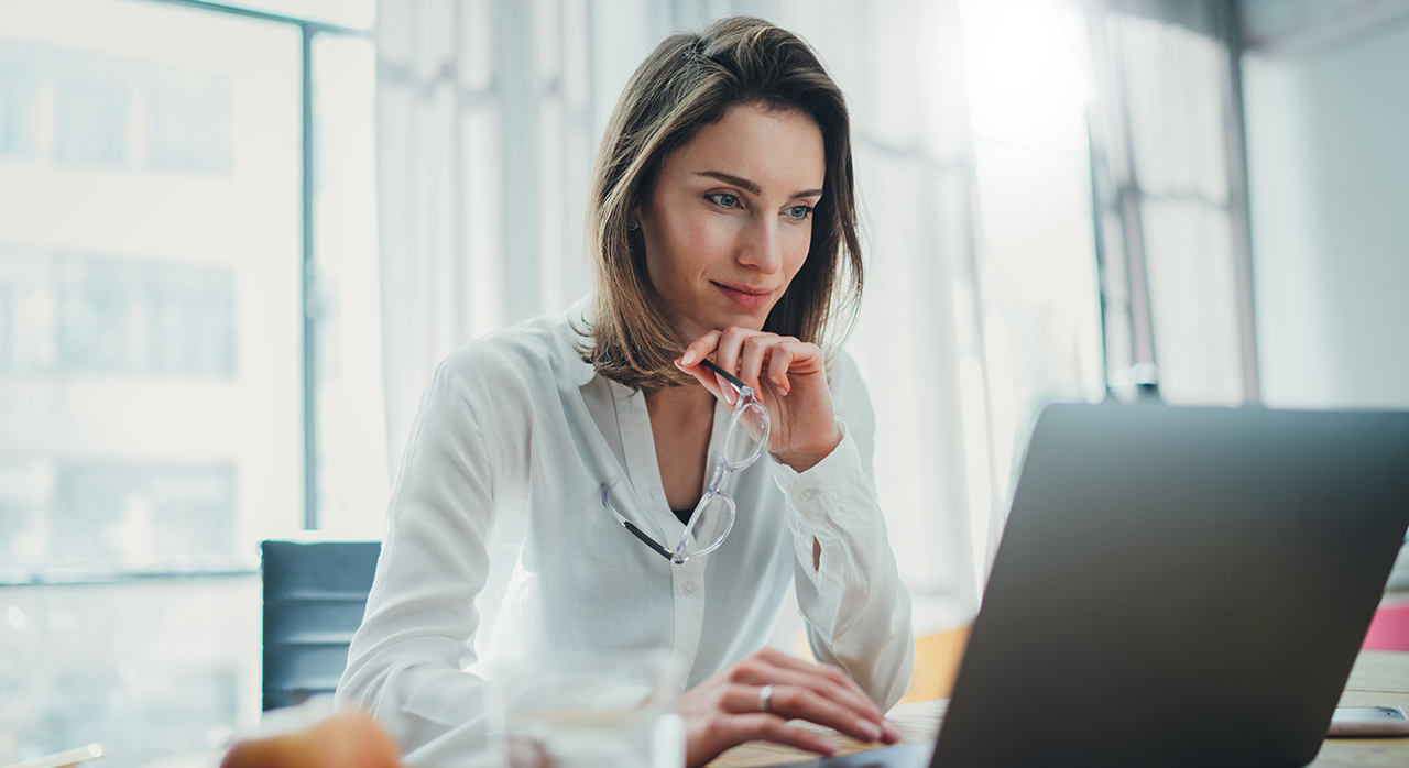 Woman viewing laptop